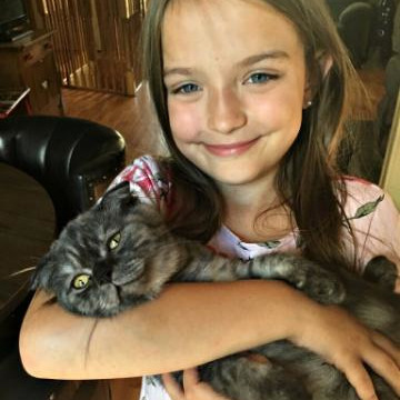 Girl holding a cat